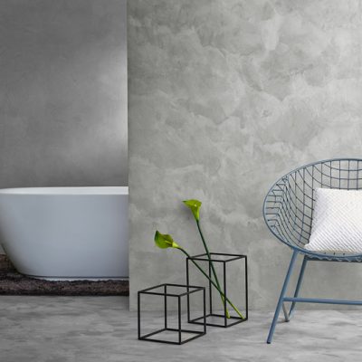 A wall to floor finish along with a chair and a bathtub